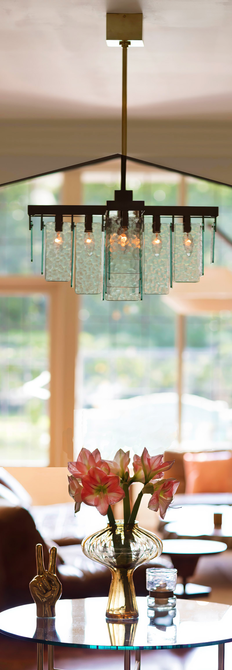 Kim Colwell used the nature view as if it was a decorative piece of art in the room to capitalize on the natural light and bring in a Biophilic element.