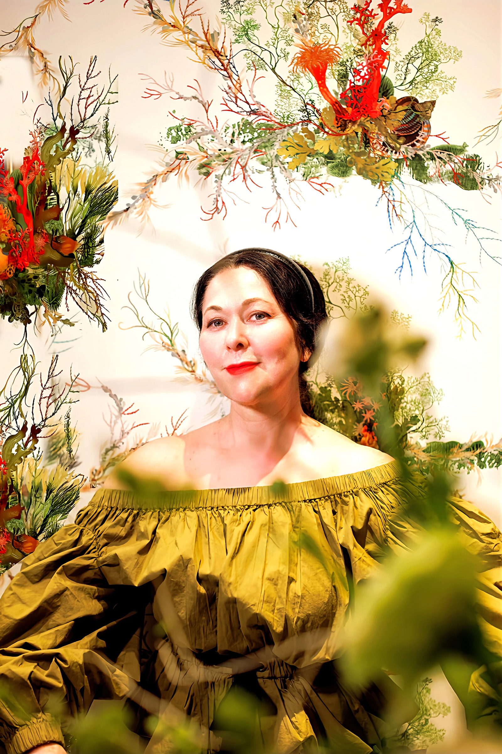 Kim Colwell wears an olive Ulla Johnson blouse to show off her newly installed Timorous Beastie wallpaper, Los Angeles inteiror design project. 