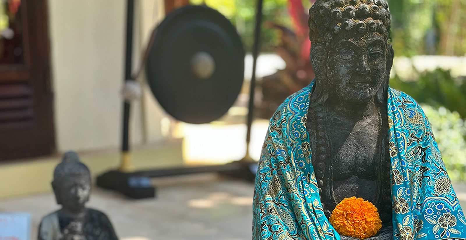 Buddha wrapped in sarong, from a trip to Bali, with Kim Colwell's House Blessing Class, Los Angeles or virtually anywhere in the world. 